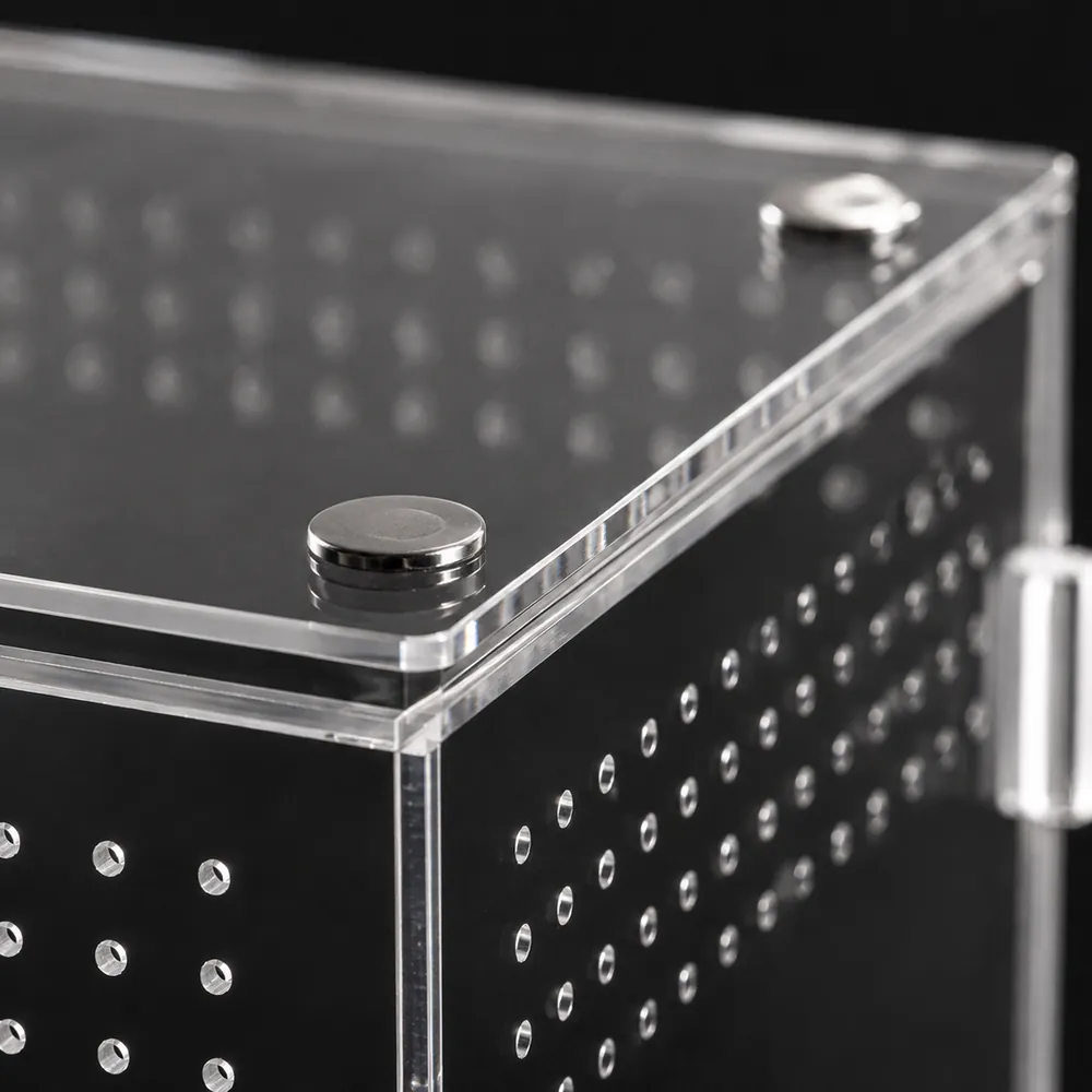 Close-up of the magnetic lid closure on a clear acrylic enclosure