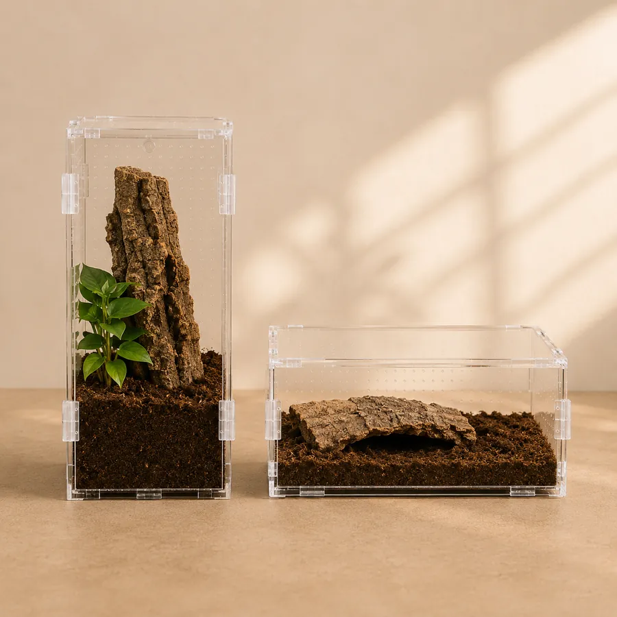 A tall arboreal enclosure and a wide terrestrial enclosure side by side